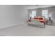 Bedroom with neutral carpet, upholstered headboard and two windows at 6833 Wispy Sky Ct, Las Vegas, NV 89142