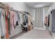 Bright walk-in closet full of clothes at 6833 Wispy Sky Ct, Las Vegas, NV 89142