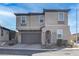 Charming home featuring a 2-car garage and neutral stucco exterior, located in a well-maintained community at 6833 Wispy Sky Ct, Las Vegas, NV 89142