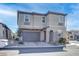 Charming home featuring a 2-car garage and neutral stucco exterior, located in a well-maintained community at 6833 Wispy Sky Ct, Las Vegas, NV 89142