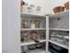 Organized pantry with ample shelving and storage space for kitchen essentials and food supplies at 6833 Wispy Sky Ct, Las Vegas, NV 89142