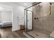 Bathroom featuring a glass-enclosed shower and views of the Primary bedroom at 6842 Empire Cliff St, North Las Vegas, NV 89084