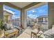 Inviting balcony view with comfortable seating overlooking the neighborhood at 7308 N Decatur Blvd # 1, Las Vegas, NV 89131