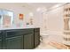 Bright bathroom featuring a modern vanity, toilet, and a shower-tub combination with a stylish curtain at 7308 N Decatur Blvd # 1, Las Vegas, NV 89131