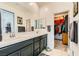 Bathroom with double sinks, closet, and modern finishes at 7308 N Decatur Blvd # 1, Las Vegas, NV 89131