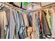Organized closet with hanging clothes and overhead storage, maximizing space efficiency at 7308 N Decatur Blvd # 1, Las Vegas, NV 89131