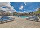 Beautiful community pool area with ample seating, shade structures and well-manicured landscaping at 7308 N Decatur Blvd # 1, Las Vegas, NV 89131