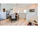 Upstairs open dining area featuring a wooden table with seating for four with wine rack and lots of light at 7308 N Decatur Blvd # 1, Las Vegas, NV 89131