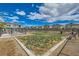 Community dog park featuring a fenced-in area with grass and seating for residents at 7308 N Decatur Blvd # 1, Las Vegas, NV 89131