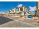 Charming townhomes featuring private garages and cozy balconies against a beautiful sky at 7308 N Decatur Blvd # 1, Las Vegas, NV 89131