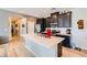 Modern kitchen featuring white countertops, stainless steel appliances, and a functional island with sink and lots of light at 7308 N Decatur Blvd # 1, Las Vegas, NV 89131
