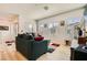 Spacious living room showcasing stylish sofas, large windows, and a comfortable layout with neutral color palette at 7308 N Decatur Blvd # 1, Las Vegas, NV 89131