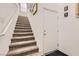 Carpeted staircase leading to the upper level with neutral walls and trim at 7308 N Decatur Blvd # 1, Las Vegas, NV 89131