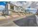 Street view featuring townhomes with balconies, garages and appealing curb appeal at 7308 N Decatur Blvd # 1, Las Vegas, NV 89131