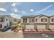 Street view featuring townhomes with balconies, garages and appealing curb appeal at 7308 N Decatur Blvd # 1, Las Vegas, NV 89131