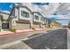 Street view showcasing townhomes with garages and well-maintained landscaping at 7308 N Decatur Blvd # 1, Las Vegas, NV 89131