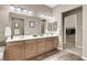 Bright bathroom featuring a double sink vanity with a separate closet at 7420 Zonal Ave, Las Vegas, NV 89131