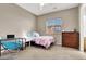 Cozy bedroom with carpet, a full size bed, a desk, and a dresser at 7420 Zonal Ave, Las Vegas, NV 89131