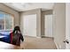 Bright bedroom featuring neutral walls, a window with blinds, and a comfortable gaming setup with an ergonomic chair at 7420 Zonal Ave, Las Vegas, NV 89131