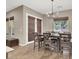 Formal dining room with elegant chandelier, a dining table set, and window at 7420 Zonal Ave, Las Vegas, NV 89131