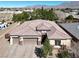 Beautiful home showcasing a three-car garage, tile roof, and desert landscaping at 7420 Zonal Ave, Las Vegas, NV 89131
