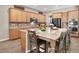 Well-appointed kitchen with a large island, granite countertops, stainless steel appliances, and seating for six at 7420 Zonal Ave, Las Vegas, NV 89131