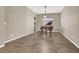 Comfortable living room with a piano and wood-look tile flooring at 7420 Zonal Ave, Las Vegas, NV 89131