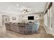 Bright and open living room with a large sectional sofa, media center, and plenty of natural light at 7420 Zonal Ave, Las Vegas, NV 89131