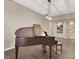 Elegant living room showcasing a grand piano and a decorative stone accent wall at 7420 Zonal Ave, Las Vegas, NV 89131