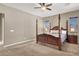 Spacious main bedroom features a four poster bed, carpet, and neutral colors at 7420 Zonal Ave, Las Vegas, NV 89131