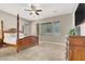 Spacious main bedroom features a four poster bed, carpet, and neutral colors at 7420 Zonal Ave, Las Vegas, NV 89131