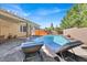 Relaxing pool area featuring clear blue water, lounge chairs, and a covered patio, perfect for outdoor enjoyment at 7420 Zonal Ave, Las Vegas, NV 89131
