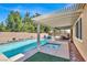 Inviting backyard pool and spa with a covered patio, perfect for outdoor relaxation and entertaining at 7420 Zonal Ave, Las Vegas, NV 89131