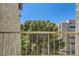Balcony featuring a view of lush greenery, with urban buildings beyond at 745 N Royal Crest Cir # 158, Las Vegas, NV 89169