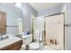 Bathroom featuring a shower-tub combo with sliding glass doors at 745 N Royal Crest Cir # 158, Las Vegas, NV 89169