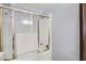 Bathroom featuring a bathtub with glass sliding doors at 745 N Royal Crest Cir # 158, Las Vegas, NV 89169