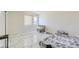 Bright bedroom with marble floors, a large window, and lots of natural light at 745 N Royal Crest Cir # 158, Las Vegas, NV 89169