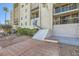 Condo building with brick entryway, stairs, and desert landscaping at 745 N Royal Crest Cir # 158, Las Vegas, NV 89169