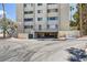 Condo exterior with parking garage and ample parking at 745 N Royal Crest Cir # 158, Las Vegas, NV 89169