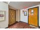 Condo hallway with unit doors and adjacent staircase at 745 N Royal Crest Cir # 158, Las Vegas, NV 89169