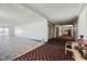 Hallway with tile and carpet flooring, elevators, and bright natural light at 745 N Royal Crest Cir # 158, Las Vegas, NV 89169