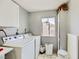 Functional laundry room with washer, dryer, and cabinet space at 745 N Royal Crest Cir # 158, Las Vegas, NV 89169