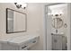 Bathroom featuring granite countertops, modern vanity, updated fixtures, and a glass enclosed shower at 7554 Violet Vista Ave # 201, Las Vegas, NV 89130