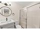 Clean and modern bathroom featuring a sleek vanity, toilet, and glass-enclosed shower with updated fixtures at 7554 Violet Vista Ave # 201, Las Vegas, NV 89130
