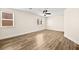 Bedroom showcasing wood flooring, neutral walls, ceiling fan and great natural light from two windows at 7554 Violet Vista Ave # 201, Las Vegas, NV 89130