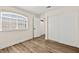 Bright bedroom with a window and a closet door at 7554 Violet Vista Ave # 201, Las Vegas, NV 89130