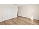 Bedroom featuring wood-look floors and a closet with sliding doors for optimal storage space at 7554 Violet Vista Ave # 201, Las Vegas, NV 89130