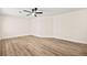 This bedroom is spacious and has new floors, fresh paint and a ceiling fan at 7554 Violet Vista Ave # 201, Las Vegas, NV 89130