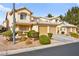 Attractive home featuring a three-car garage, manicured landscaping, and a neutral color palette at 7554 Violet Vista Ave # 201, Las Vegas, NV 89130