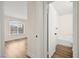Hallway view into bedroom with natural lighting and bathroom with tub and updated fixtures at 7554 Violet Vista Ave # 201, Las Vegas, NV 89130